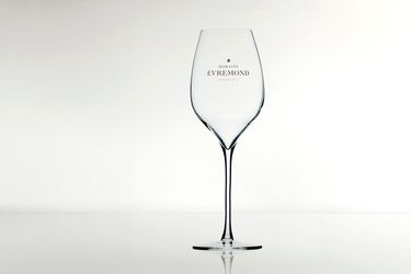 A branded Domaine Evremond wine glass